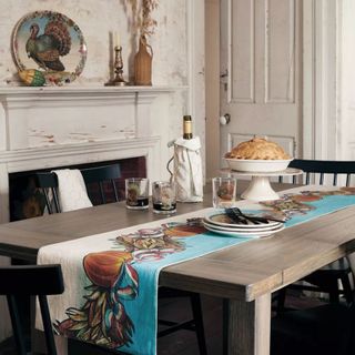 dining table decorated with Thanksgiving themed accessories