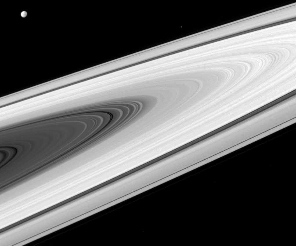 Saturn&#039;s rings and two of its moons, Dione and Epimetheus, can be seen in this image taken with the Cassini spacecraft wide-angle camera on April 2, 2016.