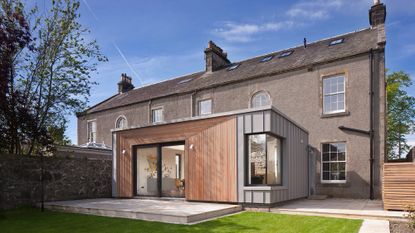 traditional victorian house with garden area and glass window