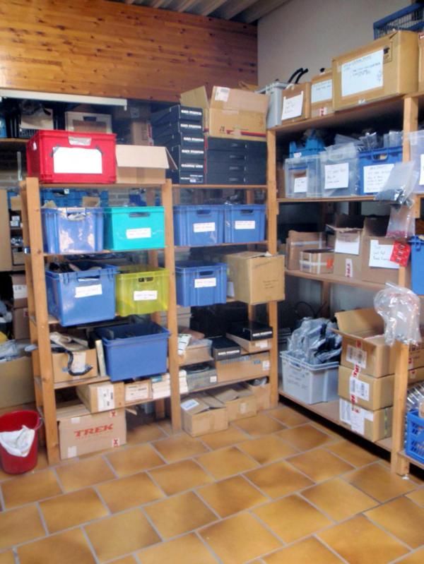Spare components are layed out in a room adjoining the workshop