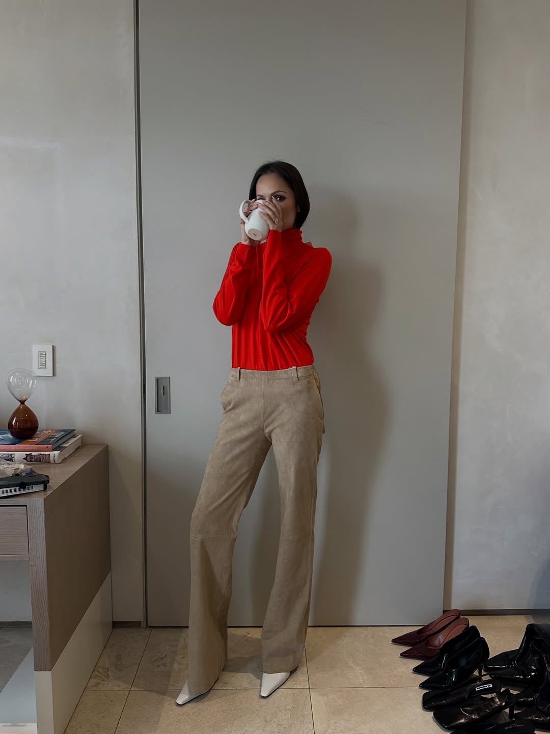 Pia Mance wearing suede pants during a fitting with stylist Georgina Downe.