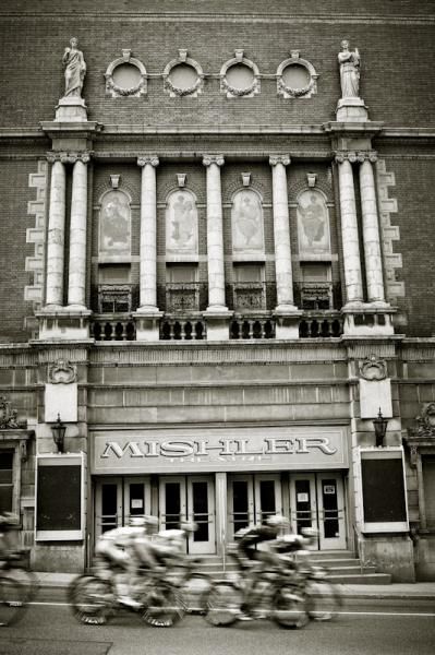 Riders pass by the old Mishler Theater in downtown Altoona.
