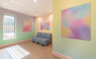 artworks on walls in pastel room