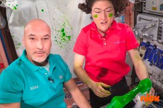 European Space Agency (ESA) astronaut Luca Parmitano and NASA astronaut Christina Koch experiment with Nickelodeon's green slime aboard the International Space Station.