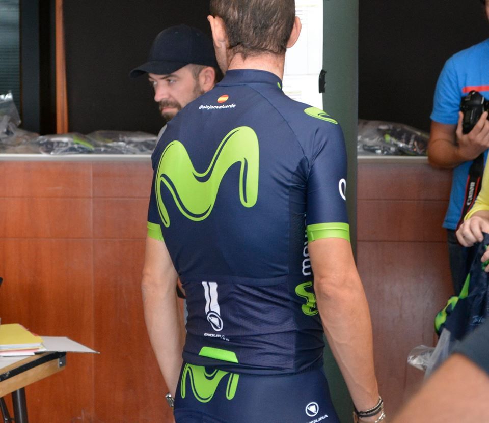 The rear of the jersey features visibility elements at the bottom