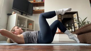 Alice Porter doing yoga at home in living room