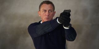 No Time To Die Daniel Craig aiming his Walther PPK