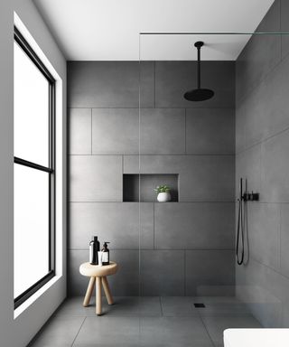 All grey tiled wet room