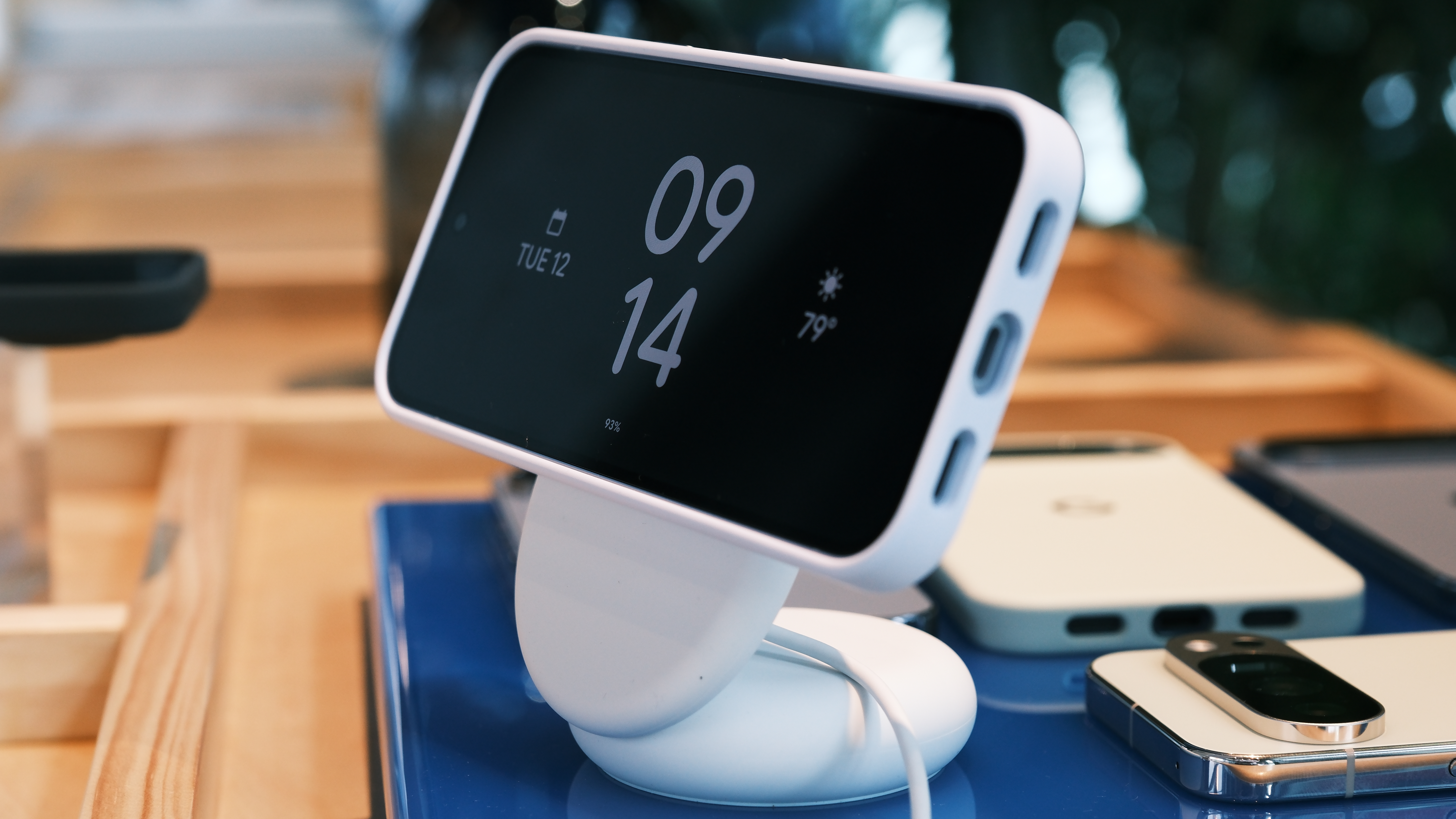 Google Pixel 10 horizontal on Pixelsnap charging stand showing time