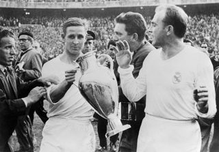 Raymond Kopa and Alfredo Di Stefano celebrate after Real Madrid's win over Fiorentina in the 1957 European Cup final.