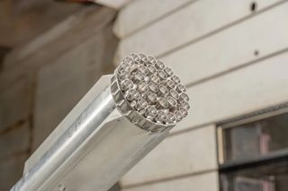 a silver model rocket inside a laboratory