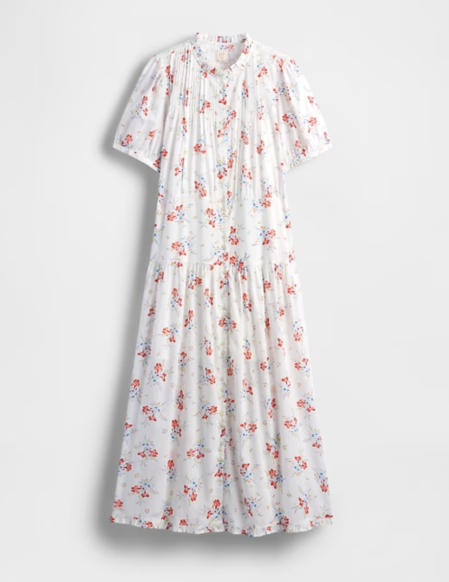a floral gap dress in front of a plain backdrop