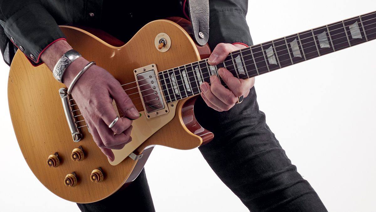 Man playing Les Paul electric guitar