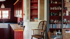 dark red kitchen, neutral cabinet with red inside, dark red shelving unit in dining room