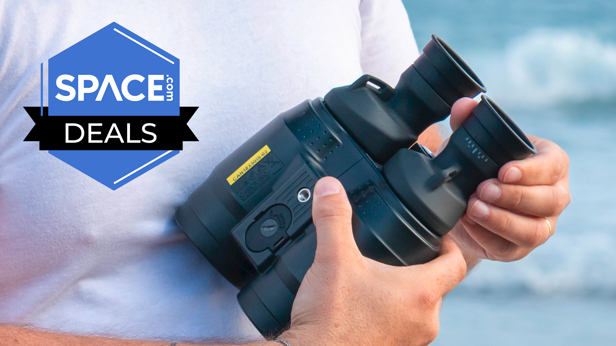 One of Space's experts holding the Canon 18x50 IS binoculars in their hands. 