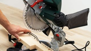 Close up of generic mitre saw on wooden table