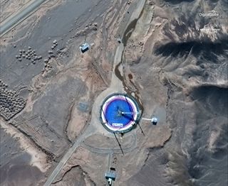 A DigitalGlobe image from Feb. 6, 2019, shows the seeming aftermath of a launch, with a blast mark on the launchpad and runoff from a post-launch washdown of the site.