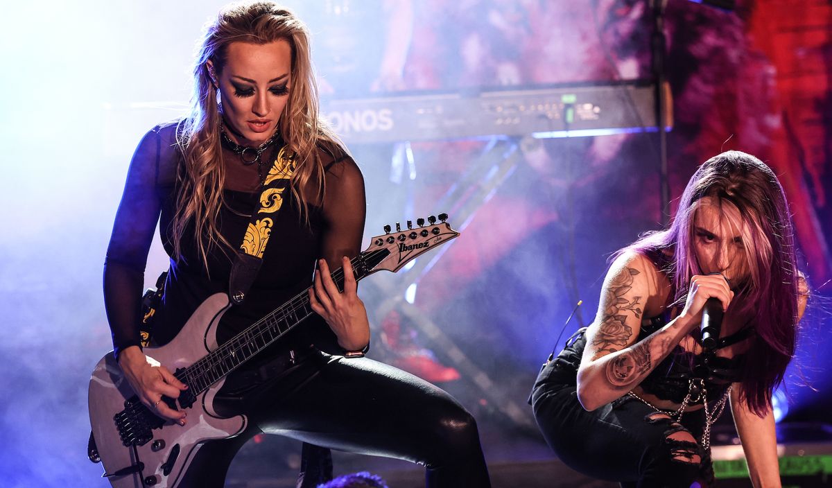 Nita Strauss (left) and Kasey Karlsen perform onstage at EXIT/IN in Nashville, Tennessee on June 13, 2023