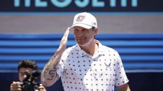 U.S. Secretary of Defense Pete Hegseth walks onstage during pre-race ceremonies prior to the NASCAR Cup Series Anduril 250 at Naval Base Coronado