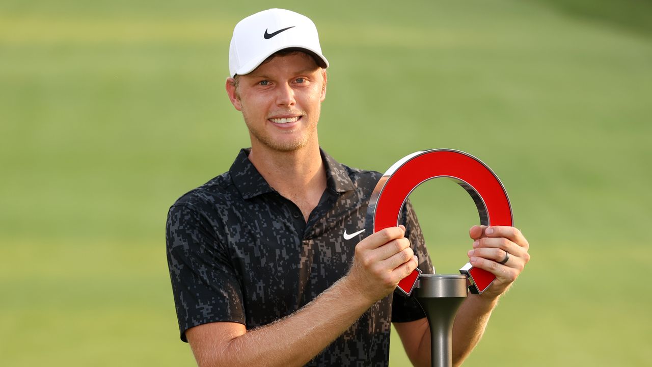 Cam Davis with the trophy after winning the 2021 Rocket Mortgage Classic