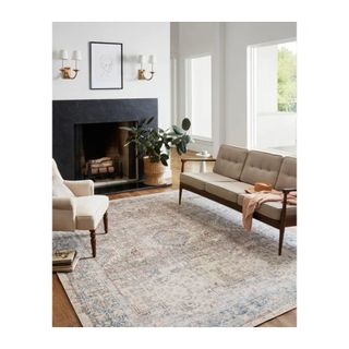 pink and blue turkish rug in a minimalist living room