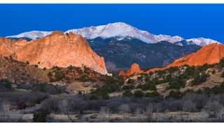 Pikes Peak looms over the Garden of the Gods in Colorado Springs