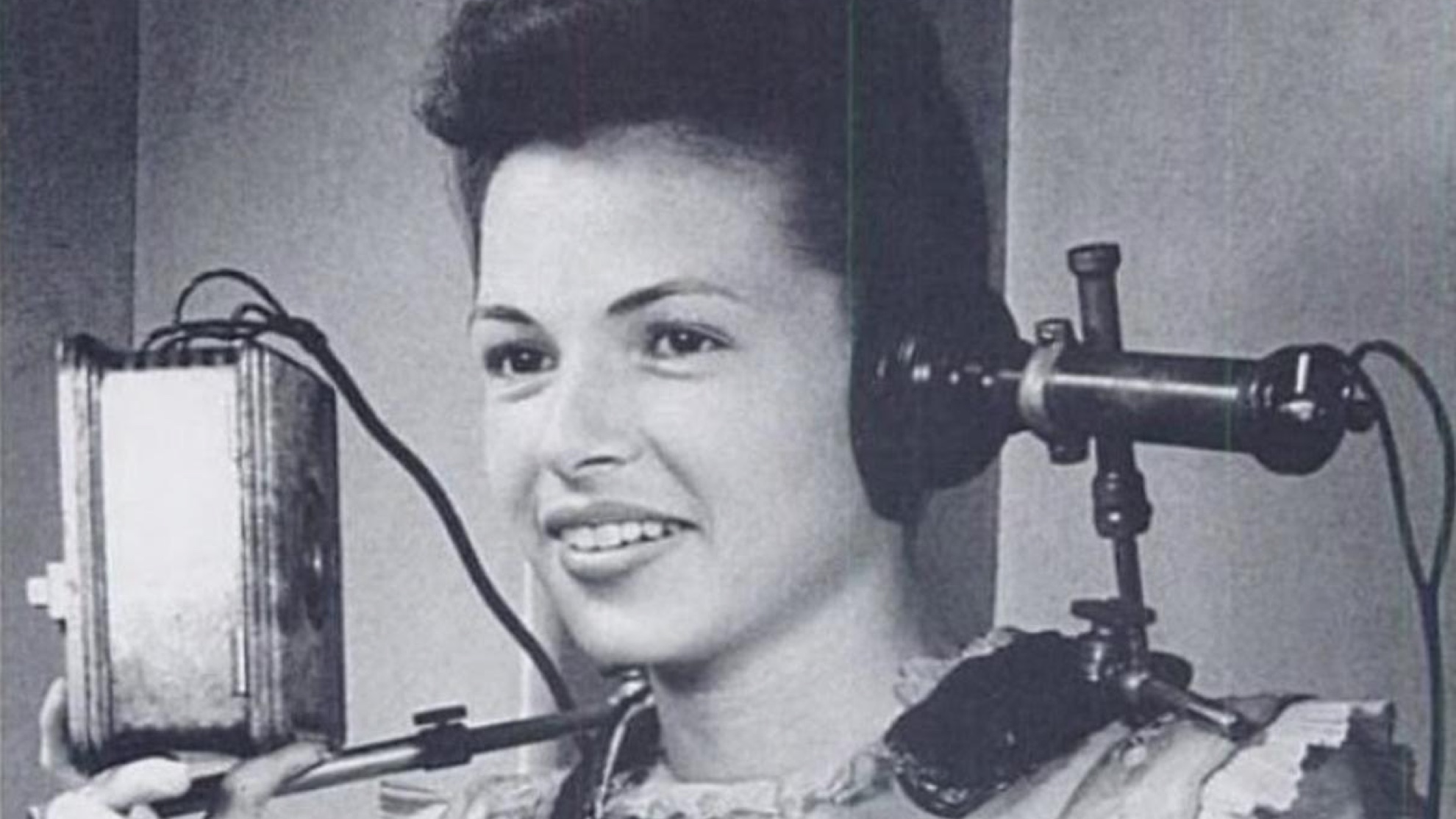 a woman wearing a pair of vintage headphones