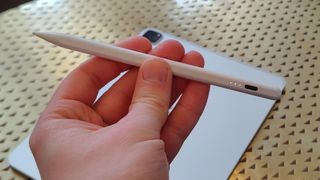 The Meko Stylus Pen in a man's hand.