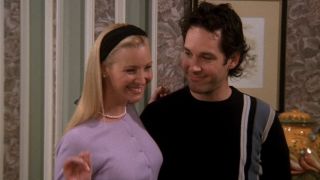 Phoebe and Mike smiling together in Friends