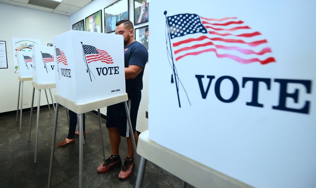 A man votes.