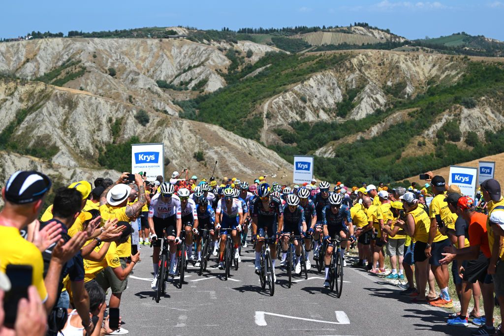 BOLOGNA ITALY JUNE 30 A general view of Pavel Sivakov of France and UAE Team Emirates Fabien Grellier of France and Team TotalEnergies Matteo Sobrero of Italy and Team Red Bull BORA hansgrohe Jonas Vingegaard Hansen of Denmark Jan Tratnik of Slovenia and Team Visma Lease a Bike and the peloton compete climbing to the Cote de Gallisterna 255m while fans cheers during the 111th Tour de France 2024 Stage 2 a 1992km stage from Cesenatico to Bologna UCIWT on June 30 2024 in Bologna Italy Photo by Dario BelingheriGetty Images
