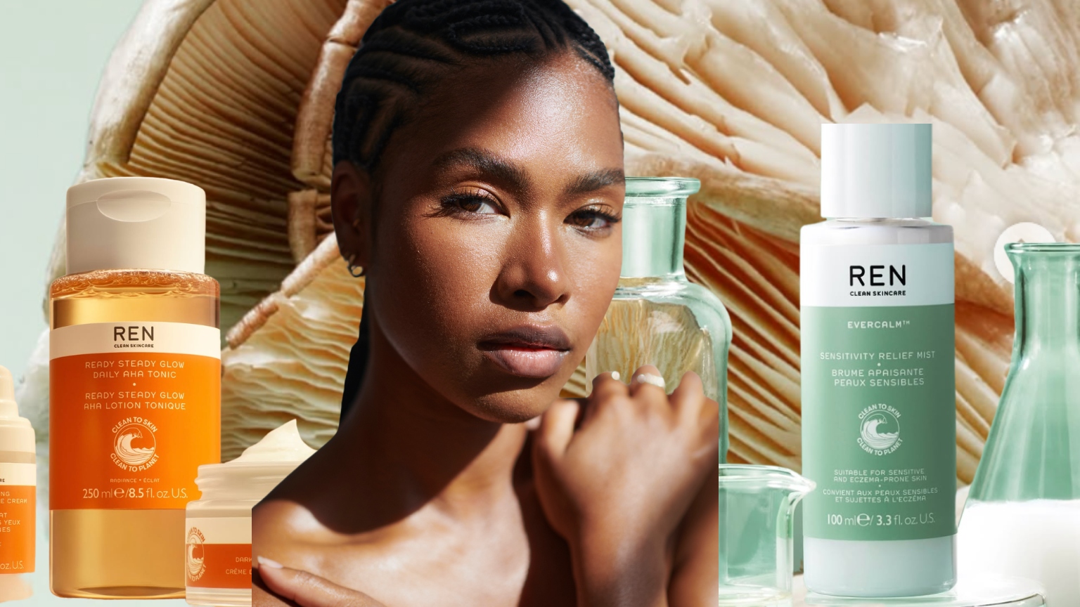 woman&#039;s torso and face surrounding by beauty product bottles