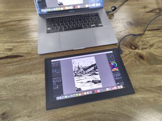 Wacom Movink review; a pen display on a wooden table