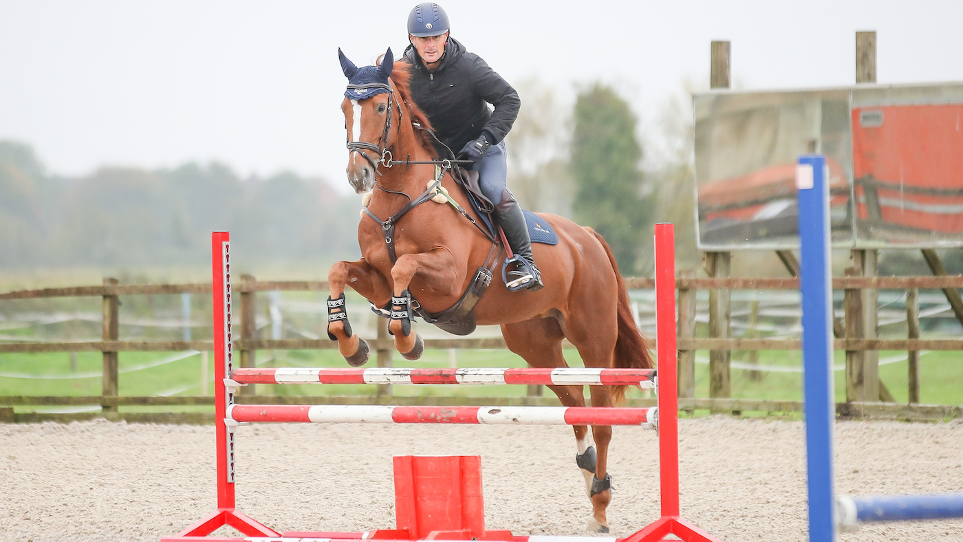 Alex Bragg training a horse to be straight over a jump