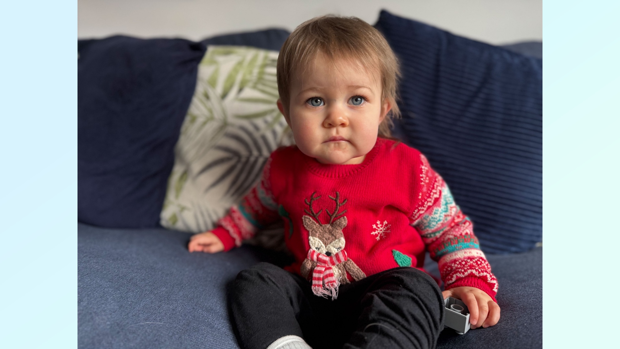 Child in festive sweater illustrating natural light in photos
