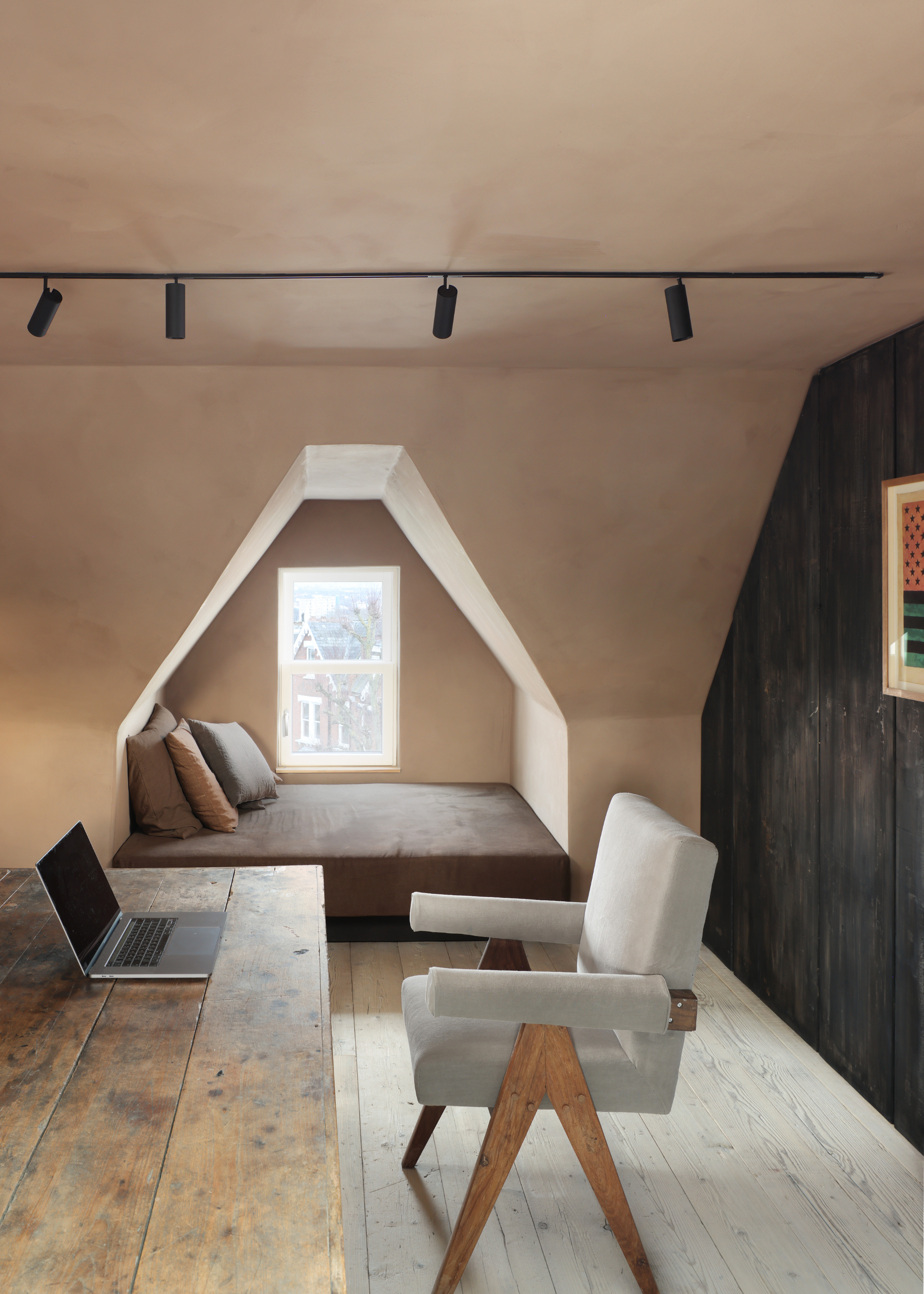 cozy study space with lots of wood and plaster finished walls