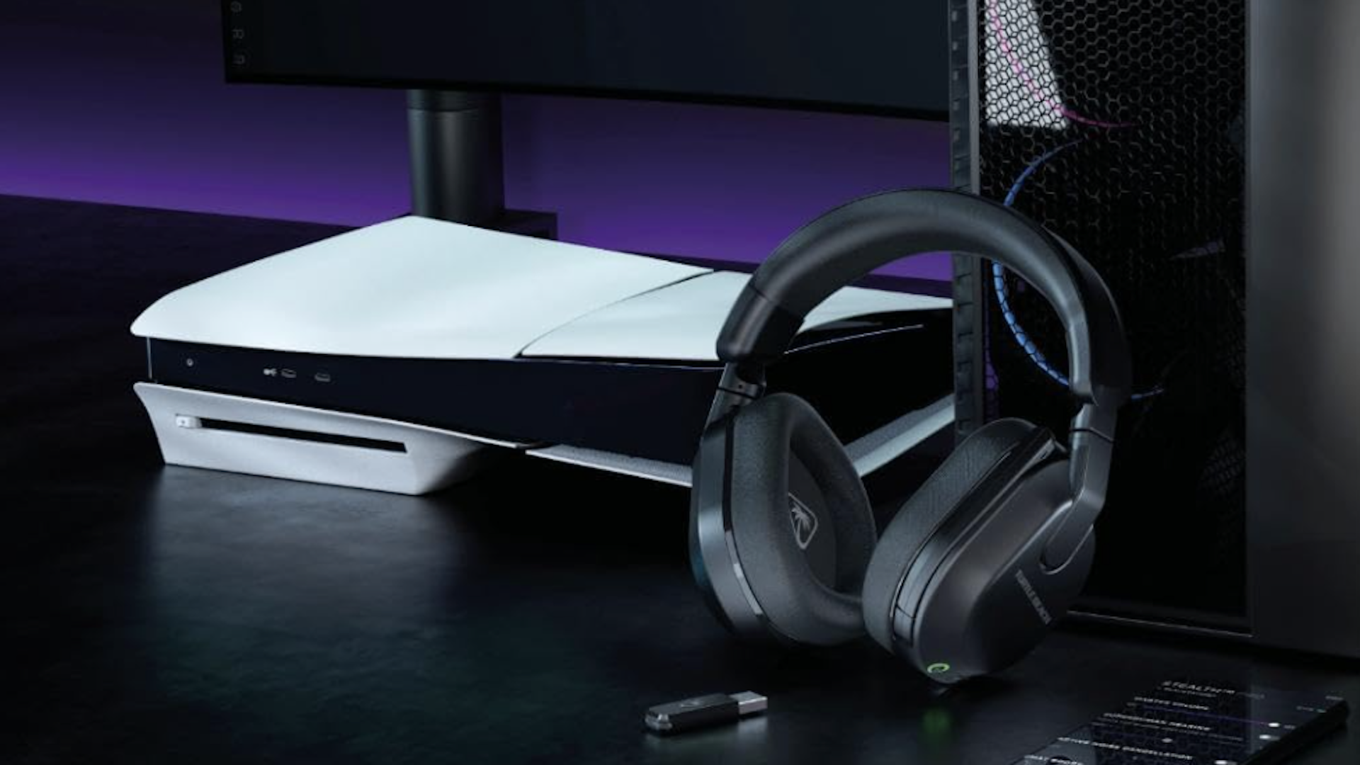 The Turtle Beach 600 wireless headset on a black table next to a PS5 console