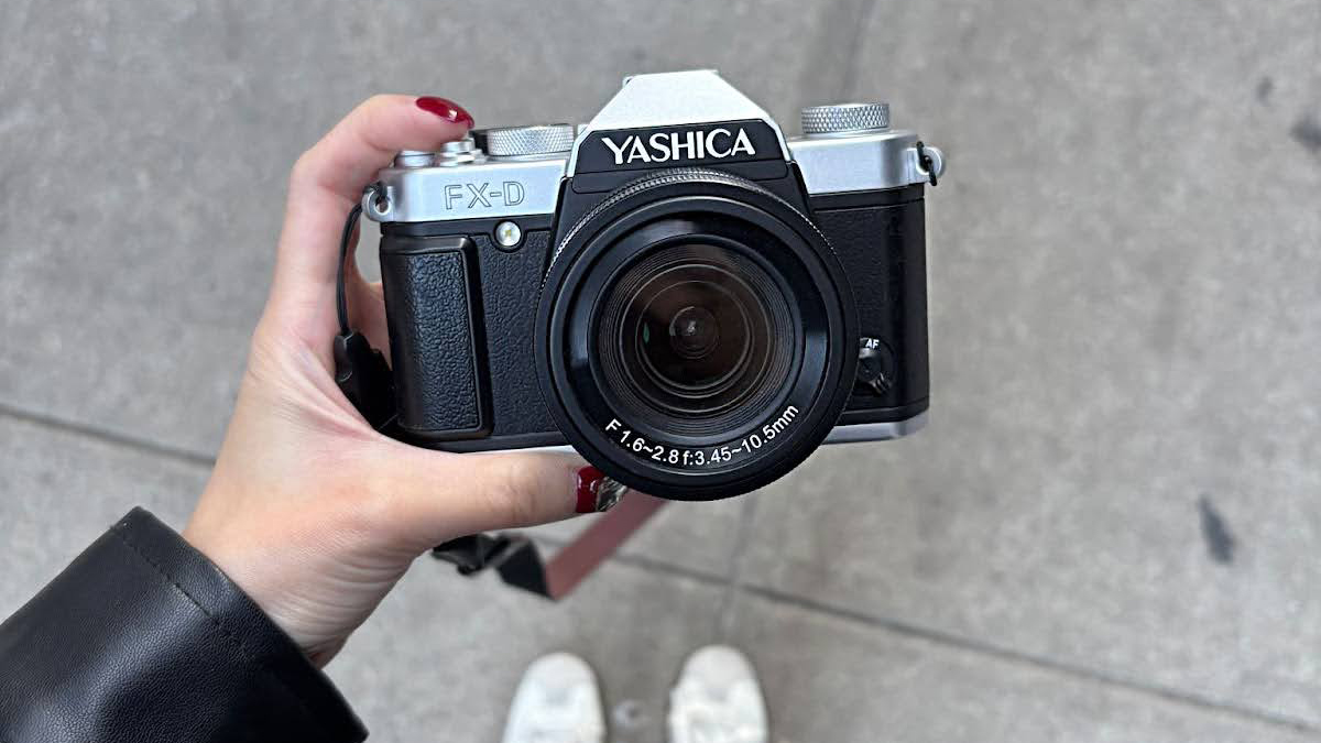 The Yashica FX-D held in a person's hands
