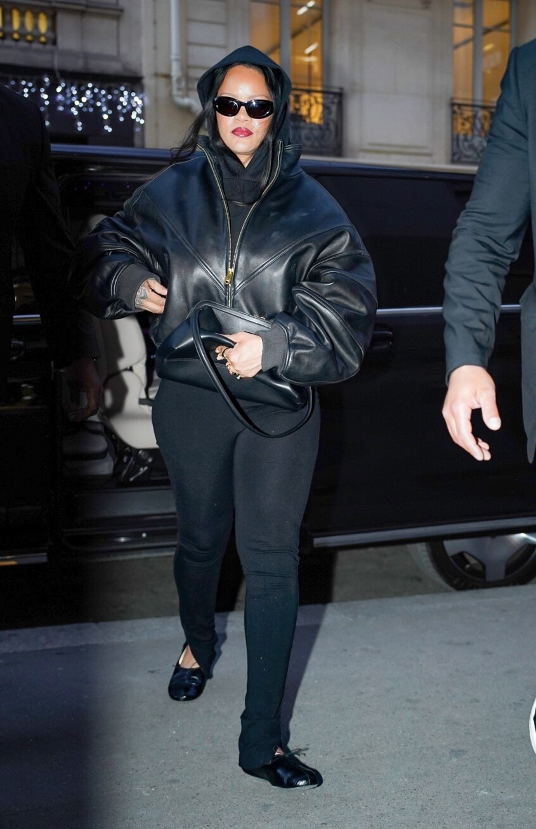 Rihanna was spotted in Paris wearing a leggings outfit with the high-vamp flats trend