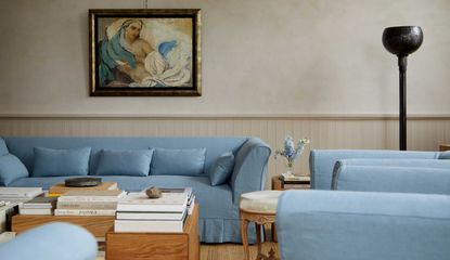 blue box pleat sofa in a living room