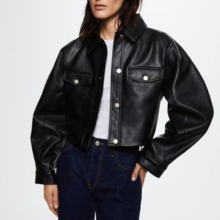 model wearing a mango black faux leather cropped jacket