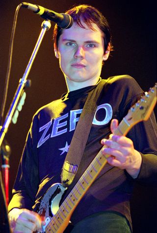 American musician, guitarist and singer Billy Corgan of rock group The Smashing Pumpkins performs live on the main stage at the Reading Festival in England on 25th August 1995.