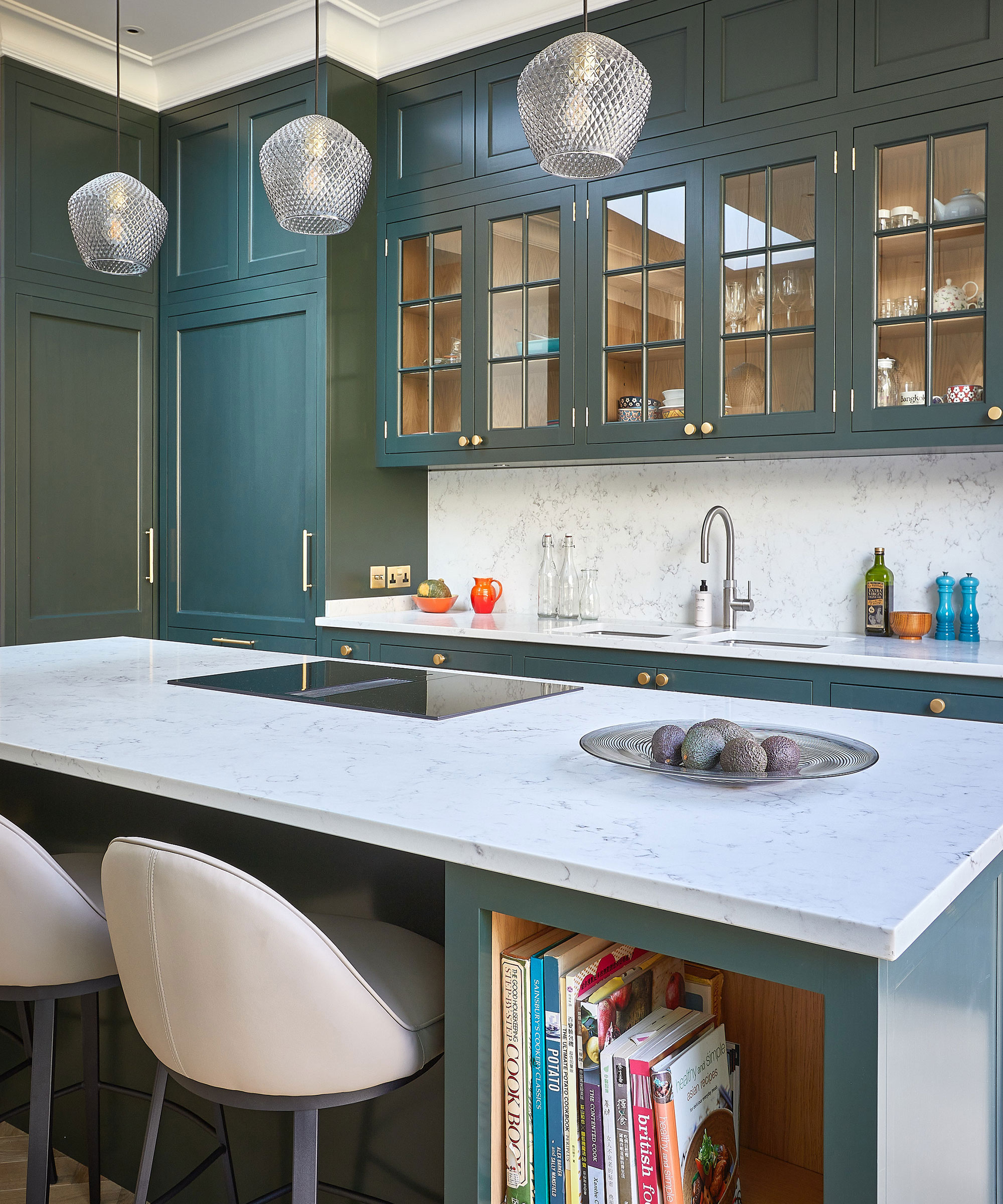 green Shaker kitchen with glass fronted wall units