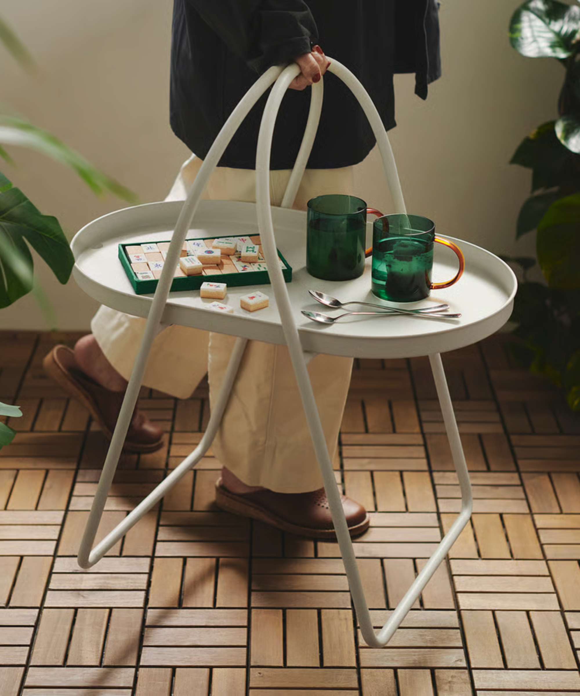 a portable outdoor coffee table with handles