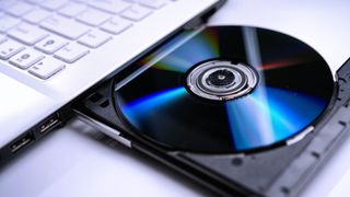 Can DVD players play Blu-ray discs? image shows disc in laptop drive