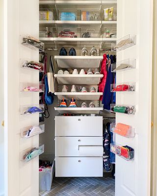closet style mudroom with storage inside and on the doors