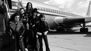 Deep Purple standing next to their Starship Jet plane on the 1974 US tour