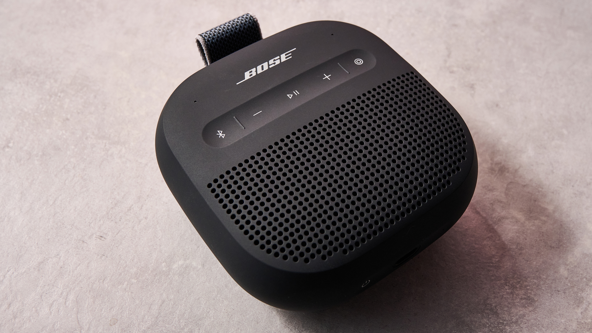 Bose SoundLink Micro Gen 2 sat on table