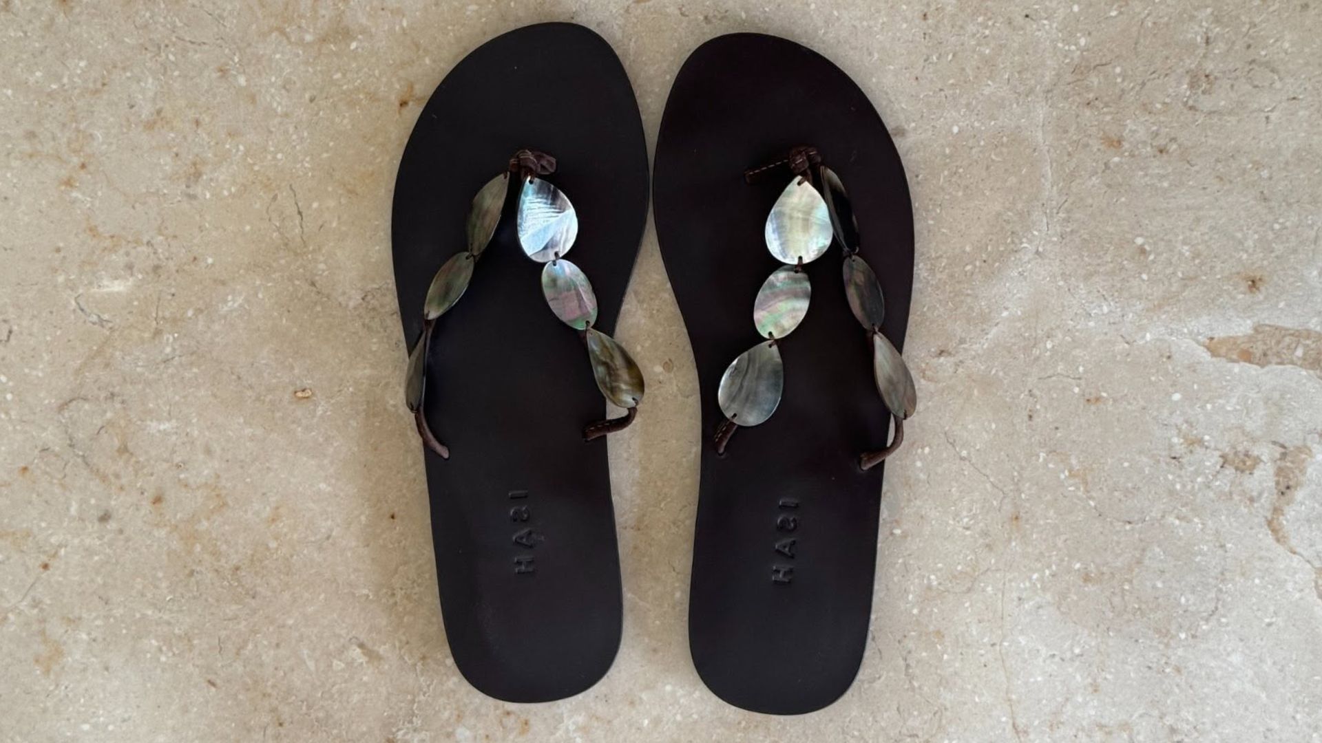 Close-up shoe of shell flip flops.