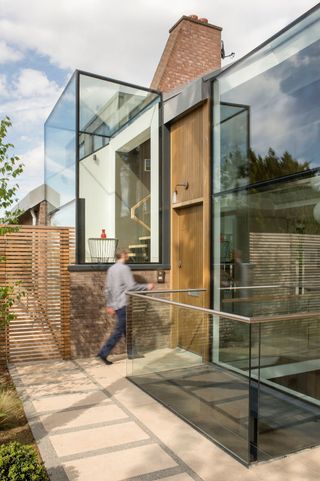 small glass extension with timber back door